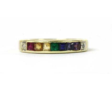 A 14ct rainbow gemstone ring, with a row of assorted gemstones, to include ruby, citrine, emerald, sapphire, amethyst, etc., 