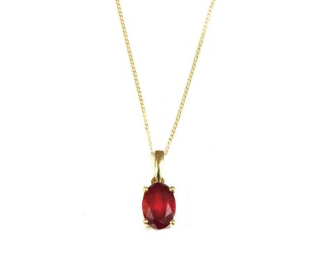 A gold single stone fracture filled ruby pendant, with an oval mixed cut fracture filled ruby, approximately 7 x 5mm, claw se