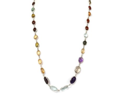 A silver assorted gemstone necklace and earrings suite, the necklace with a graduated row of assorted oval cabochon gemstones