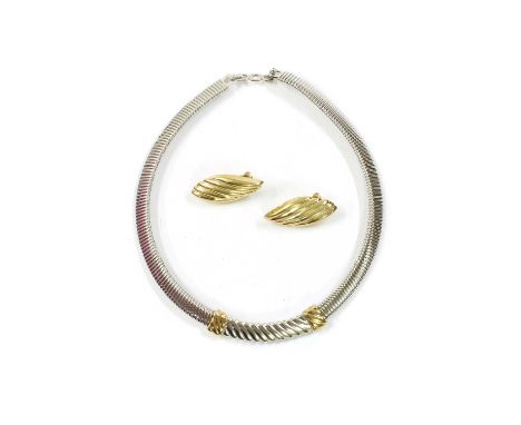 A gold plated Christian Dior necklace, with a two colour fluted centrepiece to oval tubogas style chain, with snap clasp and 