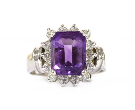 An American white gold, amethyst and diamond rectangular cluster ring, with an octagonal step cut amethyst, approximately 10 