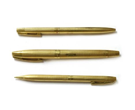 An 18ct gold three piece pen and pencil set, by Sheaffer, to include a fountain pen, and ballpoint pen, and a propelling penc