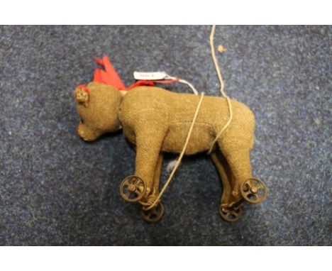 Steiff early 20th century straw filled pull along bear, 24cm long.