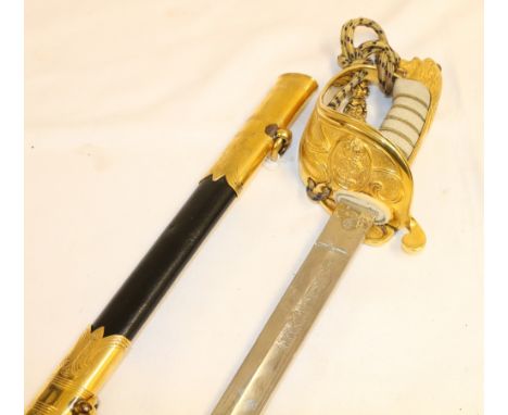 Naval officer's sword having etched blade, gothic type guard personalised to R Mends R.N (Royal Navy) fish skin grip and lion