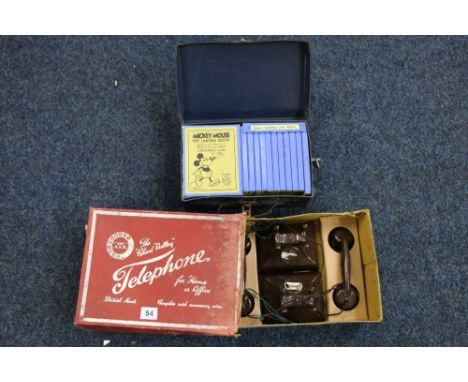 Mickey Mouse toy lantern outfit and eleven sets of slides boxed also a pair of Chad Valley bakelite telephones boxed (2). CON