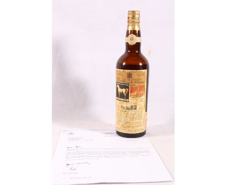 WHITE HORSE CELLAR eight year old blended Scotch whisky 4/5th quart 86.8 proof, the bottle has a replacement label which was 