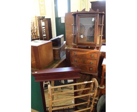 A reproduction chest of three drawers on cabriole legs, a small reproduction mahogany wall hanging display case, a wall hangi