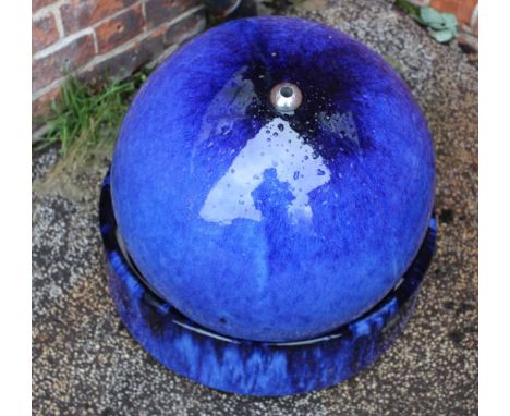 A modern blue ceramic water feature