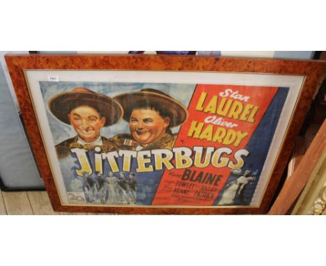 A maple framed and glazed print of film poster for Laurel and Hardy in Jitterbugs