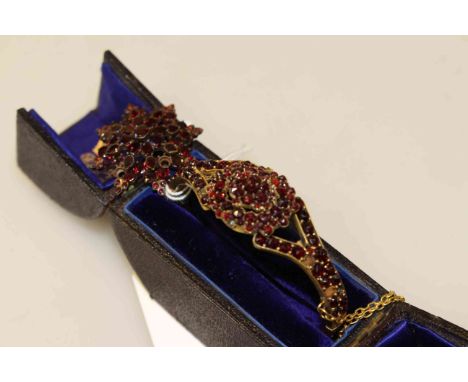 19th Century bangle and brooch, each set with red 'stones', in a box