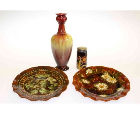 Two Linthorpe Pottery plates; together with an unmarked pepper pot and a Bretby vase (4)