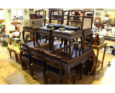 Chinese redwood extending dining table raised on elephant trunk shaped legs with twelve matching chairs