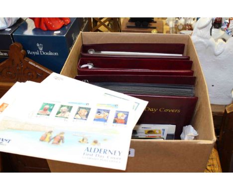 Box of first day covers in three Royal Mail albums and loose