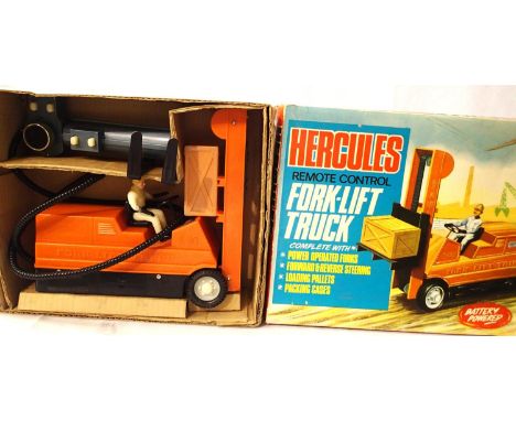 Empire made Hercules remote control forklift truck, L: 25 cm, very good condition, clean battery compartment, box is fair. P&