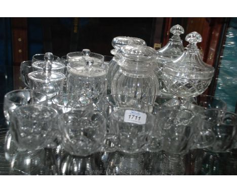 A quantity of glass including ten Custard Cups, a cut glass pickle jar and lid, a lidded sucrier and two lidded preserve jars