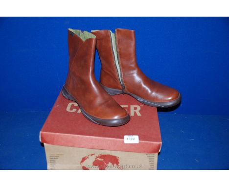 A pair of size 40 light brown leather Camper ankle Boots.