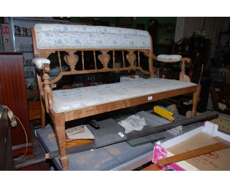 A small Edwardian Mahogany show frame Salon Sofa, having padded top rail on triple inlaid split back with spindle detail, scr