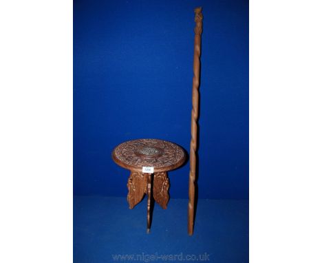 An oriental hardwood carved occasional Table of very small proportion, the circular top having central inlaid panel motif sur