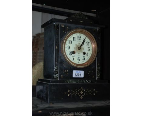 A French late 19th c. black marble and onyx architectural Mantle Clock, having ridged top over rectangular shaped front with 