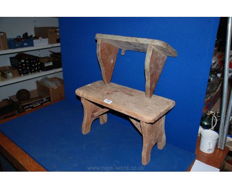 A rustic made three plank stripped pine Stool with shaped plank legs and rectangular braces, together with a distressed paint