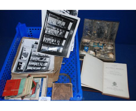 Miscellaneous black and white photographs of 'master Electrical panels', old cigarette packets, a copy of 'Aids to Materia Me
