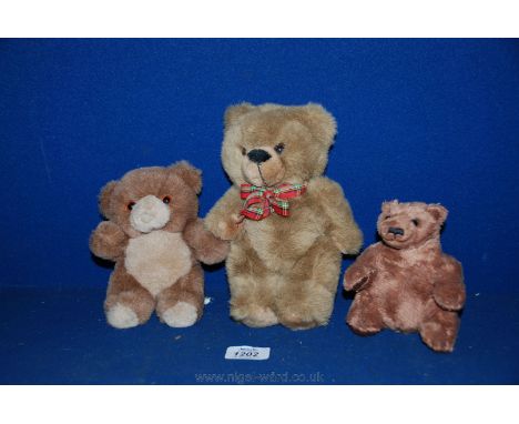 Three Teddy Bears, the largest with tartan bow by Dragon Toys Ltd, Leamington Spa, another bear made in Reichefsheim, Germany