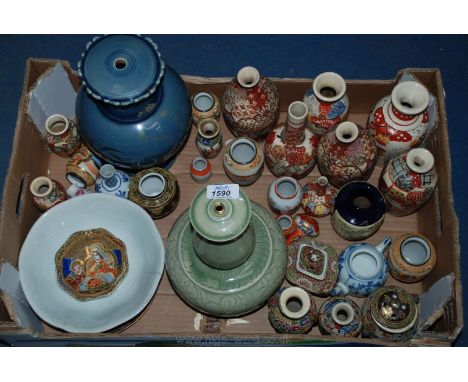 A quantity of china including a Celadon lamp base, blue lamp base and vases in varying sizes and shapes.