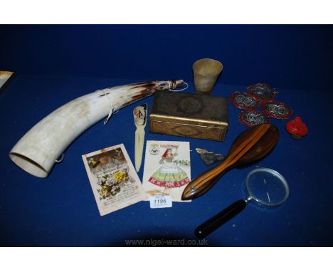 A box of miscellanea including decanter labels, horn dice shaker, cow horn, tin, postcards, etc.   