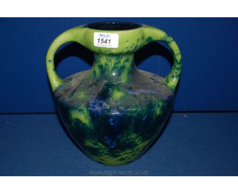 A two handled, possibly German, light green and blue mottled glaze Vase, 9'' tall.