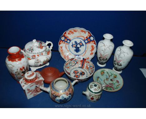 A quantity of oriental china including a pair of vases and one other, small teapot, Tea boy in Imari colours, etc.