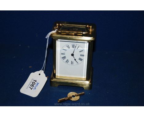 An early 20th c. French Brass Carriage Clock with key, signed R & C of Paris.