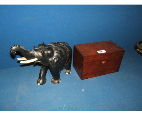 A Mahogany two compartment Tea Caddy and a large Ebony Elephant