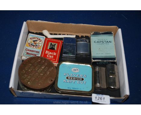 A quantity of tobacco miscellanea including packet of 'Black Cat' cigarettes, four lighters, Capstan playing Cards, Players N