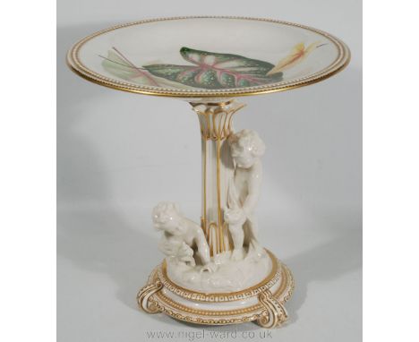 A Royal Worcester Comport with cherubs at the base, gilt beaded detail and the top plate decorated with leaves, 10'' high