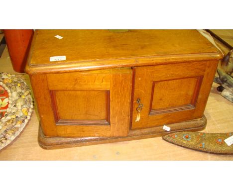 Early 20th century light oak canteen box with three drawers and cupboard front