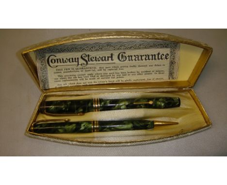 Vintage Conway Stewart writing set comprising of green marble fountain pen and propelling pencil in original box