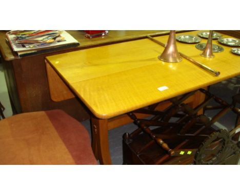 Late 20th century Designer light oak drop leaf table by David Savage (see Bio.)