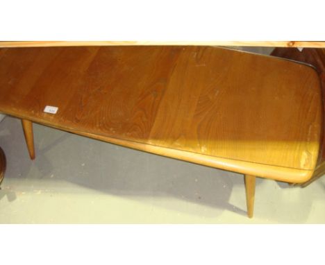 Vintage light Ercol coffee table with magazine rack under