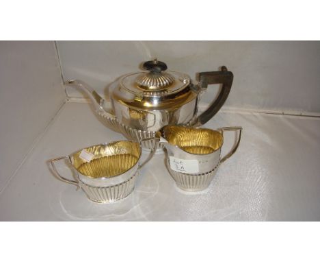 Solid silver Neo Classical shape three part  harlequin tea set with lobed edges, teapot has ebony handles and finial 511 g (i