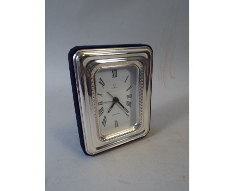 A Silver Mounted Mantle Clock.