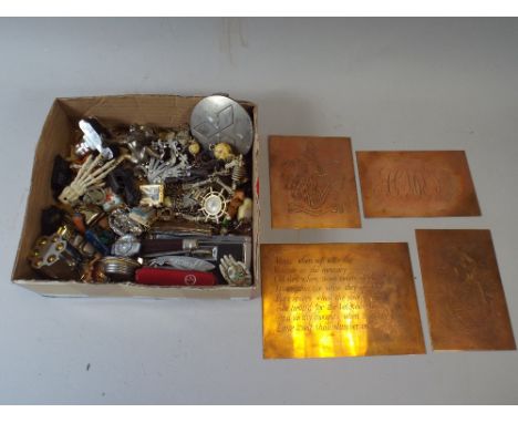 A Box of Sundries to Include Swiss Army Knife, Copper Plates, Pen Knives, Key Rings Etc.
