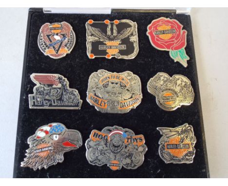 A Collection of Nine Enamelled Harley Davidson Badges.
