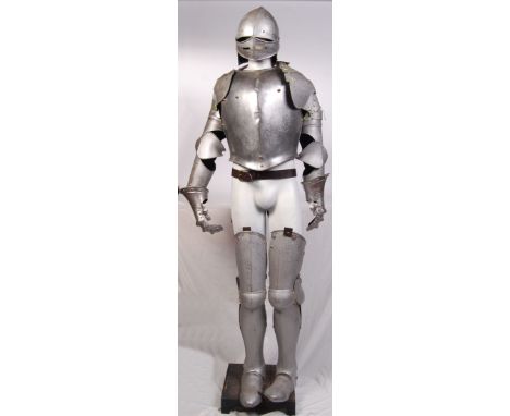 A 20th century suit of armour. Modelled after 18th century armour, the suit consists of helmet, chest plate, back plate, gaun