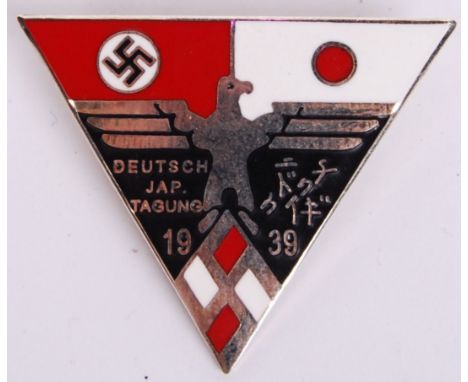 A 20th century Nazi Third Reich triangular fantasy piece&nbsp;Deutsch Jap. Jagung ( Germany &amp; Japan) enamel pin badge wit