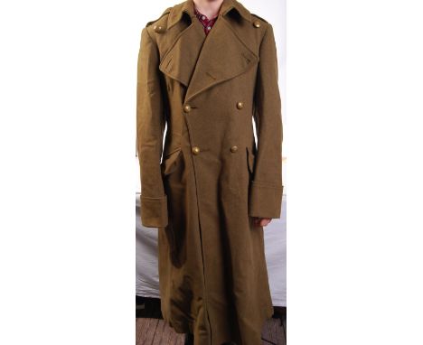 An original WWII Second World War military uniform overcoat. With brass buttons to front, Royal Army Service Corp.&nbsp;