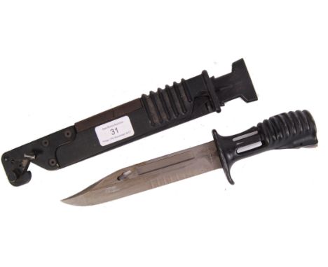 A contemporary 20th century SA80 assault rifle bayonet. Within the original scabbard, with folding saw blade. Measures approx