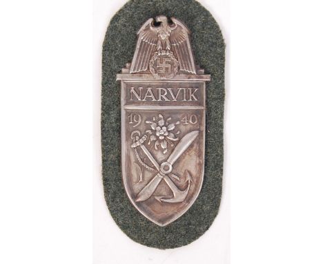 A 20th century reproduction WWII Second World War Nazi German Third Reich ' Narvik 1940 ' metal plaque / patch. Laid onto fab