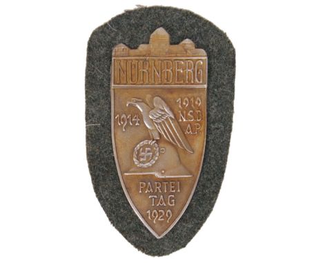 A 20th century Nazi German ' Nurnberg Parteitag 1929 ' metal plaque / patch. Laid onto fabric.   NOTE: From a private collect