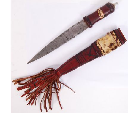 An antique 19th century African Sierra Leone Mandingo Tribe dagger with red leather decorative handle &amp; scabbard. Animal 