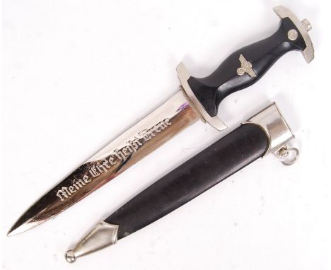 A 20th century reproduction German Third Reich Nazi SS Officers dress dagger. With eagle motif inset to handle, etched motto 